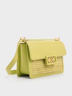 Brighten up your day and mood with this leather and raffia boxy bag in zesty lime green. This cute yet polished carrier juxtaposes a rustic woven texture against smooth calf leather -- it will stand out wherever you go. Made compact for convenience, it will hold all your essentials with ease -- it will be the star of all the outfits you pair it with. Adjust the shoulder strap to your preference, or remove it entirely to transform this chic bag into a clutch. Boxy Bags, Chic Bags, Charles Keith, Woven Texture, Lime Green, Calf Leather, Shoulder Strap, Texture, Green