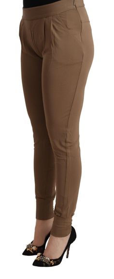 Discover the epitome of elegance with these gorgeous, brand new mid waist tapered pants from Scervino Street. Meticulously crafted with a blend of 98% Viscose and 2% Elastane, these slim-fit pants offer both supreme comfort and a flattering silhouette. The luxurious brown hue elegantly complements a range of styles, making them a versatile addition to your wardrobe. Adorned with subtle logo details, they reflect the brand’s commitment to sophistication and quality. Material: 98% Viscose 2% Elast Pants Model, Brown Logo, Browning Logo, Sneaker Jewelry, Tapered Pants, Slim Fit Pants, Guess Jeans, Street Chic, Slim Waist