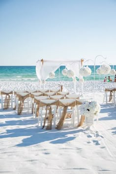 an outdoor wedding setup on the beach