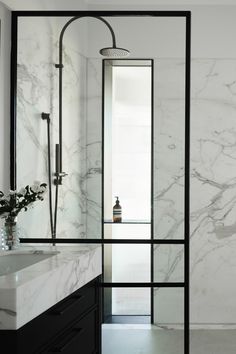 A shower recess with brass tapware, calacatta stone feature walls and fluted glass window with black steel reveals. Shower Black Hardware, Calacatta Bathroom, Ensuite Renovation, Shower Black, Window Reveal, Master Ensuite, Brass Fixtures, Victorian House, Plunge Pool