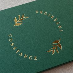 a green book with gold lettering on it