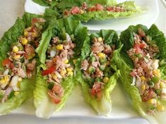 lettuce wraps with tuna and corn on a white platter, ready to be eaten