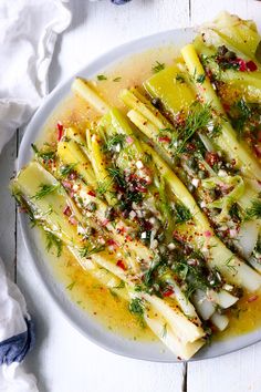 a white plate topped with sliced up vegetables