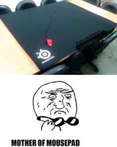 a table that has a laptop on it with the caption mother of mousepad