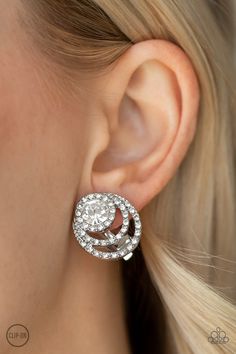 EPIC EPICENTER - WHITE (CLIP-ON) Encrusted in glittery white rhinestones, glistening silver rings circle around a solitaire white rhinestone for a refined look. Earring attaches to a standard clip-on fitting. Sold as one pair of clip-on earrings.P5CO-WTXX-095XX Nickel Free Jewelry, Circle Ring, Paparazzi Accessories, White Rhinestone, Paparazzi Jewelry, White Earrings, Affordable Fashion, Clip On Earrings, Ear Cuff