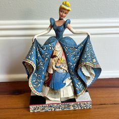 the figurine is wearing a blue dress