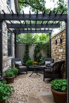 A cozy patio with wicker chairs, a small table, and potted plants under a wooden pergola. Square Courtyard Ideas, Small Paver Patio Ideas Seating Areas, Small Patio Stone Ideas, Vibey Outdoor Patio, Brick Patio Ideas, Small Covered Patio Ideas, Small Backyard Oasis, Apertment Patio With Flowers, Small Brick Fiteplace Outdoor