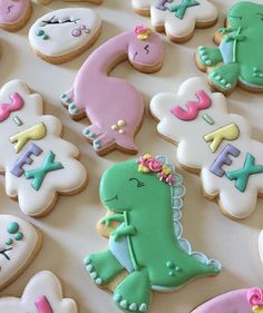 decorated cookies are arranged on a table