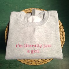 Elevate your wardrobe with our "I'm Just A Girl" Embroidered Sweatshirt, the perfect blend of style and humor! This cozy sweatshirt features high-quality embroidery that adds a touch of flair to your everyday look. Our sweatshirt makes a great gift for her, whether you're shopping for a friend, sister, or yourself. It's a fun and girly shirt that's perfect for any occasion. Treat yourself or surprise a friend with this unique piece. It also makes a thoughtful gift for birthdays, holidays, or any Cute Cotton Sweatshirt With Embroidered Graphics, Cotton Letter Print Sweatshirt, Pink Cotton Sweatshirt With Embroidered Logo, Pink Cotton Sweatshirt With Embroidered Graphics, Pink Cotton Top With Letter Embroidery, Pink Cotton Sweatshirt With Letter Embroidery, Cute Cotton Tops With Embroidered Text, I'm Just A Girl, Shirt Embroidery