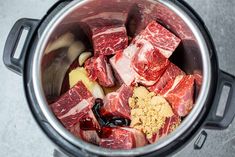 raw meat and spices in an electric pressure cooker