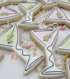 some decorated cookies are laying on the table