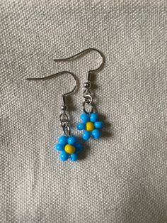 The golden palm Blue Flower Earrings With Ear Wire For Summer, Blue Flower Beaded Earrings For Summer, Cute Blue Flower Jewelry, Blue Flower Dangle Earrings For Summer, Gift Blue Flower Earrings With Colorful Beads, Cute Blue Flower Shaped Jewelry, Summer Blue Flower Beaded Earrings, Blue Dainty Hypoallergenic Flower Earrings, Dainty Blue Flower Earrings