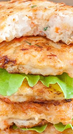 a chicken sandwich with lettuce and cheese