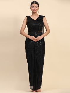 Make a dazzling entrance at any party or reception with our precious black sequins lycra reception wear ready to wear saree. This stunning saree features intricate sequin work and embroidered details, giving you a glamorous look that will surely make heads turn.
The set includes a black lycra blouse with heavy sequin work and a designer belt to complete the ensemble. This 5.5-meter saree comes fully stitched and is available in S & M sizes, making it convenient for you to wear right out of the box. Lehenga Green, Anarkali Suits Designer, Trendy Saree, Cotton Lehenga, Black Lehenga