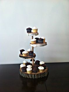 cupcakes are stacked on top of each other in the shape of a tree