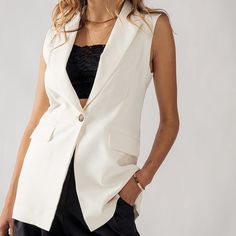 "Elevate your wardrobe with this timeless and elegant single button blazer vest. Made with a soft fabrication, this vest is perfect for spring and summer. Later it up or wear it bare. It is suitable for both casual and formal occasions, great for office wear, work wear -Notched collar and front pockets -Available in Black, Beige and Ivory -Lined. Small (2/4), Medium (6/8), Large (10) 95% POLYESTER 5% SPANDEX Model is Wearing Size Small. Model: 5'9\"  32C bust, 25\" waist, and 36\" hips.  Color m Chic Work Office, Summer Office Attire, Sleeveless Blazer Vest, Style Désinvolte Chic, Sleeveless Blazer, Single Button Blazer, Casual Work Outfit, Blazer Vest, Womens Blazers