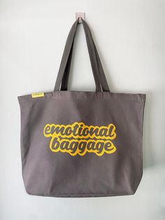 "This tote is a perfect gift and a great conversation piece! The perfect beach bag or shopping companion - strong enough for heavy jars and cans and spacious enough for a big farmer's market haul. \"emotional baggage\" print on a jumbo canvas tote *Customize your tote : Choose your tote & ink colours! Large 12 oz. 100% heavy canvas tote Tote size : 20\" x 15\" x 5\" Tote Colour: Natural, Black, Grey or Navy *Original Boomerang 360 Design Printed with eco friendly water based ink and heat set for Large Trendy Canvas Travel Bag, Casual Softback Bags For Gifts, Casual Large Capacity Beach Bag As Gift, Large Everyday Beach Bag, Large Capacity Tote Weekender Bag As Gift, Travel Canvas Shoulder Bag Gift, Travel Pouch Canvas Gift Bag, Blue Canvas Tote Beach Bag, Beach Season Canvas Tote Bag