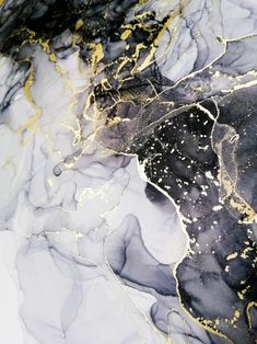 an abstract painting with black and gold paint on it's surface is shown in this image