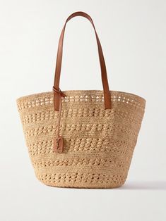 SAINT LAURENT Panier medium leather-trimmed raffia tote | NET-A-PORTER Classic Natural Straw Bag For Travel, Classic Natural Straw Travel Bag, Luxury Summer Straw Bag For Vacation, Luxury Summer Straw Bag For Beach, Classic Summer Vacation Bags, Luxury Straw Bag For Everyday Summer Use, Luxury Straw Bag For Summer, Saint Laurent Tote, Beach Essentials