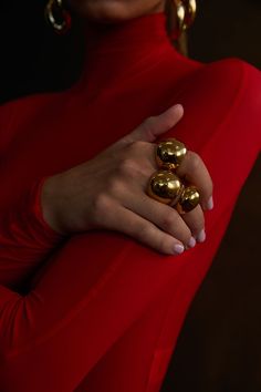 NOAH Chunky Ring Gold by Selfie Leslie Red Dress Gold Accessories Jewelry, Bold Jewelry Photography, Statement Pieces Jewelry, Fall Jewelry Aesthetic, Holiday Jewelry Photography, Red Jewelry Aesthetic, Red Gold Aesthetic, Gold Accessories Aesthetic, Christmas Jewelry Photography