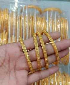 Set of 4 gold bangles ...the bangles have self design on it. These look real gold alike.Non openable bangles. *P.S: non returnable product. Please ask any question if you have related to this product before purchasing as returns for size, Color,weight etc are not covered. Buyer is responsible for return shipping cost in other cases. Gold Openable Round Bangle, Gold Plated Openable Gold Bracelets, Gold Bangle For Festivals, Gold Plated Temple Jewelry Bangle, Gold Bangle Bracelet For Festive Occasions, Gold Openable Bangle Bracelet, Gold Bangle Hand Set As Gift, Festive Gold Bangle Bracelets, Gold-plated Openable Gold Bracelet