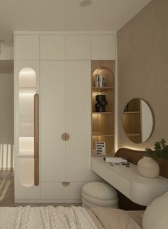 a bedroom with a bed, dresser and mirror on the wall next to a closet