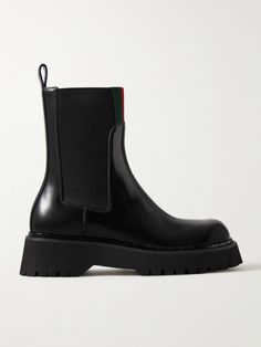 Gucci's 'Thea' boots are trimmed with signature webbing stripes along the cuffs, making them instantly recognizable to fans of the house. Crafted in Italy from glossed-leather, they're set on chunky rubber lug soles and have elasticated inserts for easy on-and-off. Winter Work Wear, Shoes Boots Ankle, Black Chelsea Boots, Ballet Pumps, Leather Chelsea Boots, Boot Pumps, Ski Wear, Clothes Collection, Net A Porter