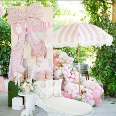 an outdoor area with pink and white decorations