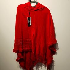 Red, Asymmetric, Detailed, Hooded Pancho. One Size Hooded Red Poncho For Fall, Red One-size Poncho Cape, Red Long Sleeve Poncho, One Size, Red One-size Cape Poncho, Red One Size Cape Poncho, Red Hooded Poncho For Fall, Red Winter Cape One Size, Casual Red Long Sleeve Poncho, Red Oversized Poncho For Winter