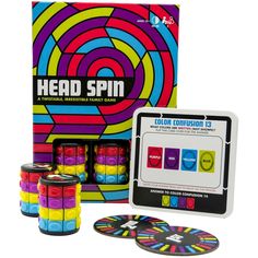 the head spin board game is in front of its box and four pieces are shown