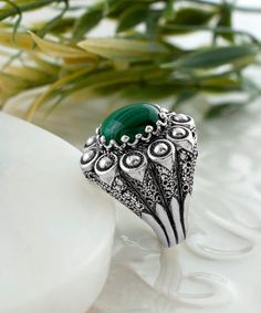 Elevate your style with our stunning Embroidery Ring with Malachite Gemstone, handcrafted with the finest materials. The ring boasts a 925 sterling silver band, meticulously designed with intricate filigree art and an oxidized finish, providing an antique look. The Malachite gemstone is a 10x12 mm cabochon oval cut, set in a bezel setting, offering a pop of striking green color to the piece. The ring face measures 0.9 inches / 22.50 mm in length and 0.80 inches / 20.00 mm in width. The ring come Embroidery Ring, The Ring Face, Dome Ring, Special Ring, Sterling Silver Filigree, Domed Ring, Silver Filigree, Sterling Silver Bands, The Deep