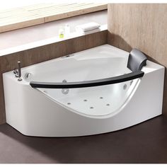 a white bath tub sitting next to a window