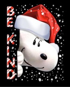 a snoopy dog wearing a santa hat