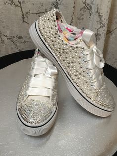 Handmade to precision with Swarovski Crystals & Pearls with satin ribbon laces. Elegant Wedding Sneakers With Rhinestones, Lace-up Wedding Shoes With Rhinestones For Party, Elegant Lace-up Wedding Shoes With Rhinestones, Silver Sneakers For Wedding With Round Toe, Silver Lace-up Sneakers For Wedding, Wedding Lace-up Sneakers With Rhinestones, Wedding White Embellished Sneakers, White Rhinestone Party Sneakers, White Party Sneakers With Rhinestones