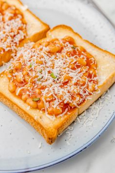 two pieces of toast topped with beans and cheese