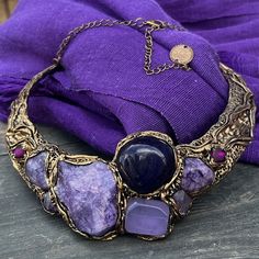 "Chunky choker collar necklace, purple crystal necklace, raw stone necklace, Calcite Agate Chalcedony necklace. Looking for more items in this style? Pick your favorite from the list below: https://etsy.me/2M6q0bX You might also be interested in the matching RING, see the separate listing here: https://www.etsy.com/il-en/listing/1168958324/huge-chunky-ring-big-purple-oversize?click_key=47c3c119c8c3a4837c758b54c73f2eed3e48b801%3A1168958324&click_sum=a21c9720&ref=shop_home_active_13&pro=1&frs=1&st Bohemian Purple Choker Jewelry, Purple Bohemian Choker Jewelry, Bohemian Purple Natural Stone Necklace, Purple Metal Jewelry With Natural Stones, Artisan Jewelry With Purple Natural Stones, Purple Jewelry With Natural Stones In Metal, Artisan Purple Jewelry With Natural Stones, Purple Jewelry With Natural Stones, Unique Purple Jewelry With Natural Stones