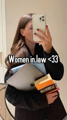 a woman taking a selfie in front of a mirror with the caption women in law 33