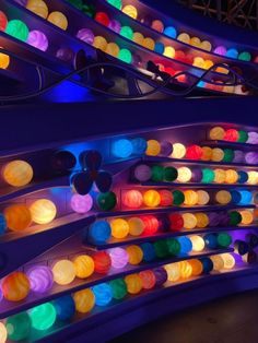 colorful lights are lit up on the ceiling