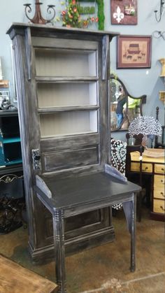 an old bookcase with a chair in front of it