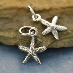 Starfish Charm, TINY Starfish Pendant, Sea Star Charm, Sterling Silver Charm, Ocean Charm, Beach Charm, Beach Wedding Charm, PS01299 This listing is for one very pretty TINY sterling silver starfish charm. Great for all of your jewelry making  and crafting needs.  This is perfect for your beach themed wedding accessories.  Measurements: 14.5mm x 8.5mm x 1.5mm sterling silvermillpond jewelry comillpondjewelrycojewelry suppliesjewelry findingssilver charmsilver pendantstarfish charmstarfish pendantsea star charmocean charmbeach charmbeach pendant Decorating Rocks, Beaded Starfish, Wedding Charm, Sea Jewelry, Ocean Floor, Starfish Pendant, On The Ocean, Ocean Jewelry, Nautical Jewelry