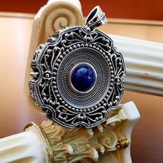 This impressive pendant is made of oxidized pure silver 925. The center of it is decorated with a genuine round Lapis Lazuli stone. It is a really eye catching pendant. The big open bale allows you to have the pendant with your favorite thick chain or cord. Dimensions : Pendant : 5cm, with bale 6.3cm Lapis : 12mm For more Byzantine designs visit : https://www.etsy.com/shop/YianniJewellery Greek Jewellery, Greek Ring, Sterling Silver Cross Pendant, Silver Cross Pendant, Greek Jewelry, Jewelry Antique, Lapis Lazuli Stone, Sterling Silver Cross, Silver Cross