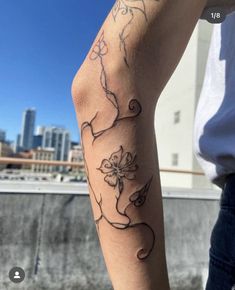 a person with a flower tattoo on their arm