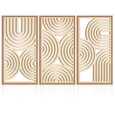 three wooden panels with circular designs on the front and back, each in different sizes