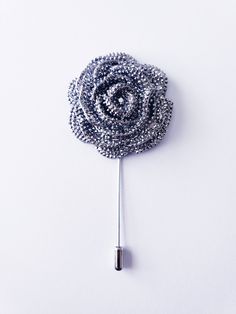 Looking for a standout accessory to elevate your style game? Search no more! Our Rose Rhinestone Lapel Pin is the epitome of elegance and sophistication. It is also perfect as a tie tack or badge and is a flawless addition to your suit or tuxedo, available in silver, black, or grey. Crafted with meticulous attention to detail, the flower measures approximately 1.75 inches (L x W), and the entire pin is about 3.5 inches long. This accessory serves as a stunning focal point for your ensemble, be i Glamorous Formal Brooches With Bling, Elegant Rhinestone Brooch For Party, Glamorous Formal Brooches With Rhinestones, Elegant Party Brooches With Bling, Silver Rhinestone Pins For Formal Occasions, Luxury Silver Lapel Pin For Party, Formal Silver Pins With Rhinestones, Elegant Silver Pins For Evening, Glamorous Silver Brooches For Party