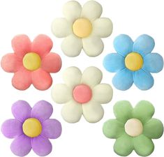 four flower shaped hair clips in different colors