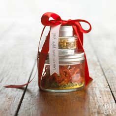 a glass jar filled with different types of spices