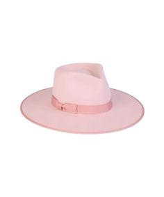 Inspired by vintage men’s styles, this hat is designed to make a statement. A stiffened wool fedora with rigid crown design. Trimmed on hat and rim with tonal gross grain ribbon. Pastel Pink Rancher fedora hat Trimmed with tonal Pink gross grain edged hat rim and bow ribbon detail 100% soft Australian wool Spot / specialist clean Brim measures 10 cm / 3.95” This hat is accredited with a UPF Rating 50+ (Australian Tested) Size + Fit: Rancher sizing runs slightly wide/large due to crown design Siz Vintage Men Style, Statement Hat, Rancher Hat, Wool Fedora, Halo Style, Cosmetic Items, Bow Ribbon, Crown Design, Wearing A Hat