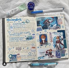 an open book with anime stickers and pens on it next to a marker pen