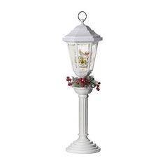 a white lamp post with holly and berries on the top is shown in front of a white background