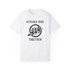 Comfort Colors® Witches Rise Together Shirt - Vintage Feminist Halloween Vibes! ----------------------------------------------------------------------------------------------------------------- Embrace the power of sisterhood this Halloween with our Comfort Colors® Witches Rise Together Shirt! Featuring three fierce witches flying together on one broomstick, this Vintage Halloween Women Shirt is all about unity, empowerment, and a touch of witchy magic. The bold phrase, "Witches Rise Together," sends a message of solidarity, making it the ultimate Feminist Witch Shirt for those who believe in girl power and equality. This shirt is perfect for celebrating spooky feminist vibes, whether you're standing up for reproductive rights, women's rights, or rocking your I'm Speaking Shirt. Wear it pr White Halloween Letter Print Top, White Halloween Shirt With Letter Print, Halloween Cotton Tops With Custom Print, Halloween Cotton Shirt With Sublimation Print, White Halloween Shirt With Sublimation Print, White Shirt With Halloween Sublimation Print, White Halloween Shirt With Screen Print, Witches Flying, Girl Power Shirt